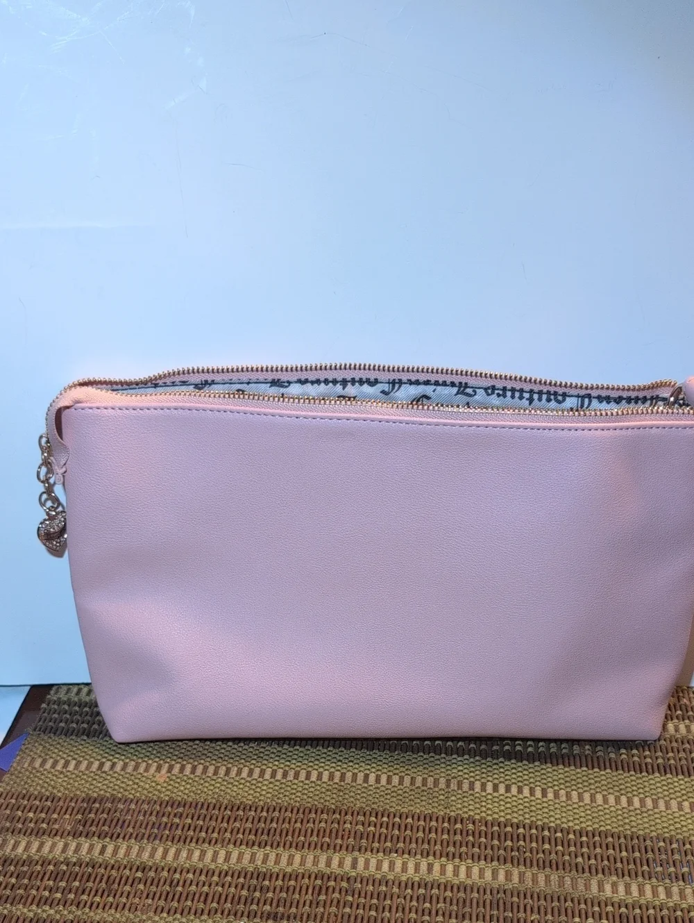 Juicy Couture Light Pink Vegan Leather Clutch Bag With Gold Hardware.
